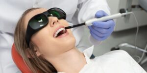 Patient receiving laser dental treatment at 92 Dentistry in Portland, OR