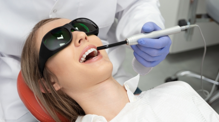 Patient receiving laser dental treatment at 92 Dentistry in Portland, OR